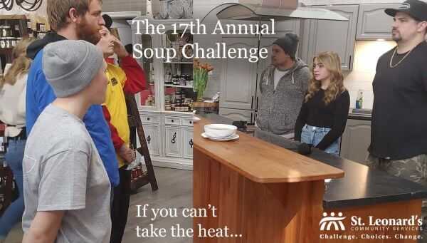 People standing in a kitchen before the soup challenge.